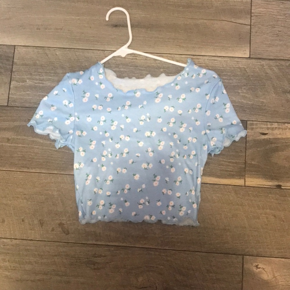 this is a cute crop top with floral designs